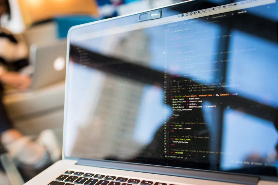 Laptop with code editor open while checking page indexability