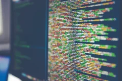 Colourful structured code on a monitor, representing JSON-LD examples