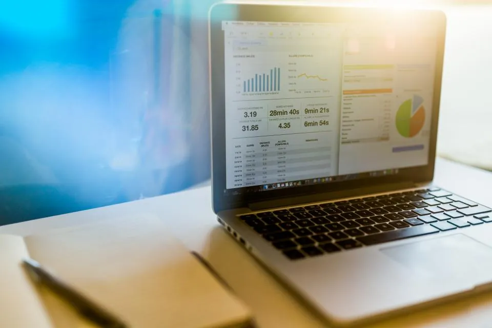 Laptop displaying an SEO crawl report with charts