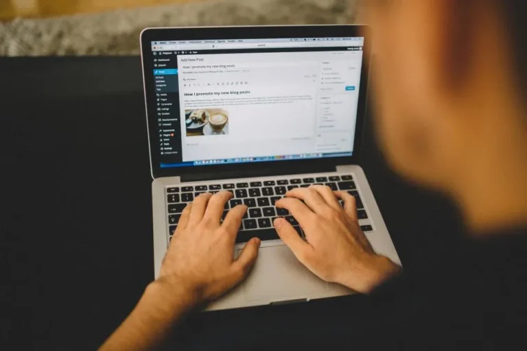 Blogger typing on a laptop during a weekly SEO routine